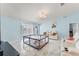Open living room with theater seating, backyard access, and light blue walls at 134 Foggy Creek Ct, Davenport, FL 33837