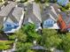 Aerial view of rooftops of homes with trees and the walkway at 13890 Sato Ave, Orlando, FL 32827