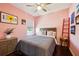 This bedroom features bright walls and a unique ladder accent, creating a cheerful space at 13890 Sato Ave, Orlando, FL 32827
