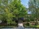 Charming home with inviting front yard, lush landscaping, and welcoming walkway to the front door at 13890 Sato Ave, Orlando, FL 32827