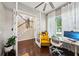 This home office features a bright workspace with a desk, comfortable chair, and natural light at 13890 Sato Ave, Orlando, FL 32827