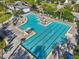 A stunning aerial view of the community pool with multiple lounge areas and seating at 13890 Sato Ave, Orlando, FL 32827