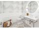 Stylish bathroom featuring patterned wallpaper, elegant sink, and decorative wainscoting at 1400 Nottingham St, Orlando, FL 32803