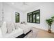 Bedroom featuring large windows with beautiful views, light hardwood floors, and modern decor at 1400 Nottingham St, Orlando, FL 32803
