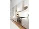 Bright kitchen featuring stainless steel appliances, white cabinetry, and sleek countertops at 1400 Nottingham St, Orlando, FL 32803