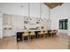 Open kitchen with a large island, pendant lighting, and modern appliances at 1400 Nottingham St, Orlando, FL 32803