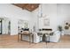 Bright living room featuring a fireplace, wood ceiling beams, and neutral furniture at 1400 Nottingham St, Orlando, FL 32803