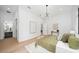 Bright main bedroom featuring an ensuite bathroom and hardwood floors for a luxurious feel at 1400 Nottingham St, Orlando, FL 32803