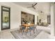 Covered patio featuring a dining table and an opening into the living room; great for indoor/outdoor living at 1400 Nottingham St, Orlando, FL 32803
