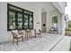 Inviting front porch with modern furniture and stylish accents, offering a welcoming outdoor space at 1400 Nottingham St, Orlando, FL 32803