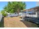 The backyard features a screened patio area and a spacious, well-maintained lawn perfect for outdoor activities at 1415 Sherbourne St, Winter Garden, FL 34787