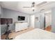 Spacious bedroom with a ceiling fan, soft carpet, and a dresser at 1415 Sherbourne St, Winter Garden, FL 34787