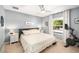 Relaxing bedroom featuring a ceiling fan, carpet floors, and a window letting in natural light at 1415 Sherbourne St, Winter Garden, FL 34787