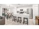 Bright kitchen featuring stainless steel appliances, a center island with seating, and ample countertop space at 1415 Sherbourne St, Winter Garden, FL 34787