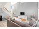 The spacious living room features a vaulted ceiling, staircase, large windows, and tile flooring at 1415 Sherbourne St, Winter Garden, FL 34787
