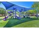 Community playground with colorful play structures, slides, and ample shade, designed for enjoyment and recreation at 1415 Sherbourne St, Winter Garden, FL 34787