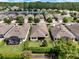 Aerial view of a neighborhood with well-maintained homes, mature trees, and private backyards at 1424 Palisades Lane, Deland, FL 32724
