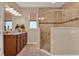 Bathroom features tile floors, granite counters, a shower with glass doors at 1424 Palisades Lane, Deland, FL 32724