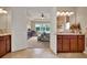 Bathroom with double doors leading to bedroom with ensuite bathroom and walk in closet at 1424 Palisades Lane, Deland, FL 32724