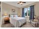 Bedroom features a large window, side tables and an accent chair at 1424 Palisades Lane, Deland, FL 32724
