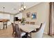 Bright dining area with seating for six shows open floorplan to kitchen at 1424 Palisades Lane, Deland, FL 32724