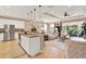 Open-concept kitchen featuring a large island, stainless steel appliances, and ample counter space at 1424 Palisades Lane, Deland, FL 32724