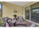 Comfortable screened patio with stylish decor, offering a relaxing outdoor space for leisure at 1424 Palisades Lane, Deland, FL 32724