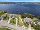 Scenic aerial shot of lakeside houses with private docks and well-maintained landscaping at 14315 Hampshire Bay Cir, Winter Garden, FL 34787