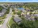 A well planned residential community with a pond, fountain, mature trees, and landscaped yards at 14315 Hampshire Bay Cir, Winter Garden, FL 34787