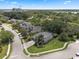 Scenic aerial perspective of residences amid verdant trees and manicured lawns in the distance at 14315 Hampshire Bay Cir, Winter Garden, FL 34787