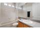 Bright bathroom with a tub, shower, vanity, and tiled walls, creating a clean and functional space at 14315 Hampshire Bay Cir, Winter Garden, FL 34787
