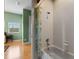 Bathroom featuring a tub and shower with white tile and a leafy-patterned shower curtain at 14315 Hampshire Bay Cir, Winter Garden, FL 34787