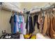 Walk-in closet with wire shelving and hanging rods, packed with neatly arranged items at 14315 Hampshire Bay Cir, Winter Garden, FL 34787