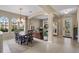 Inviting dining area with large windows and a stylish chandelier at 14315 Hampshire Bay Cir, Winter Garden, FL 34787