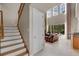 Welcoming entryway showcasing staircase and great room with natural light at 14315 Hampshire Bay Cir, Winter Garden, FL 34787