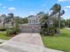 Charming two-story home with a three-car garage and a brick-paved driveway at 14315 Hampshire Bay Cir, Winter Garden, FL 34787