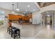 Modern kitchen with breakfast bar and views into the living area at 14315 Hampshire Bay Cir, Winter Garden, FL 34787