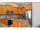 Modern kitchen with stainless steel appliances and ample storage at 14315 Hampshire Bay Cir, Winter Garden, FL 34787