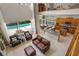 Open-concept living area with a modern kitchen, dining space, and a cozy living room overlooking the pool, great for entertaining at 14315 Hampshire Bay Cir, Winter Garden, FL 34787