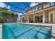 Private screened-in pool with an outdoor grilling area and covered patio at 14315 Hampshire Bay Cir, Winter Garden, FL 34787