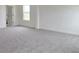 Spacious carpeted bedroom with ample natural light from windows and neutral color palette at 14647 Crestavista Dr, Clermont, FL 34714