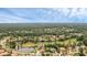 Aerial view showcasing the home's location on a picturesque lot with pond views and lush landscaping at 1518 Shadowmoss Cir, Lake Mary, FL 32746