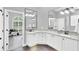 Bright bathroom with double sinks, granite countertops, modern fixtures, and ample cabinet space for storage at 1518 Shadowmoss Cir, Lake Mary, FL 32746