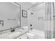 Well-lit bathroom featuring a tub with shower, granite counters, and modern fixtures providing a relaxing space at 1518 Shadowmoss Cir, Lake Mary, FL 32746