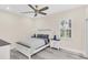 Cozy bedroom with a ceiling fan, window with plantation shutters, and laminate floors creating a serene atmosphere at 1518 Shadowmoss Cir, Lake Mary, FL 32746