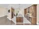 Gourmet kitchen featuring custom cabinets, granite countertops, stainless steel appliances, and an island with seating at 1518 Shadowmoss Cir, Lake Mary, FL 32746