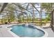Beautiful pool area with a seating area and fountain under a screened enclosure that offers a serene and private retreat at 1518 Shadowmoss Cir, Lake Mary, FL 32746
