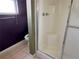 Bathroom featuring a shower with glass doors and tile floors at 1705 Betrillo Ct, The Villages, FL 32162
