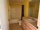 Full bath featuring a tub with shower, and a large vanity at 1705 Betrillo Ct, The Villages, FL 32162