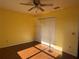 Bedroom featuring a closet, a ceiling fan, and a wood-look floor at 1705 Betrillo Ct, The Villages, FL 32162
